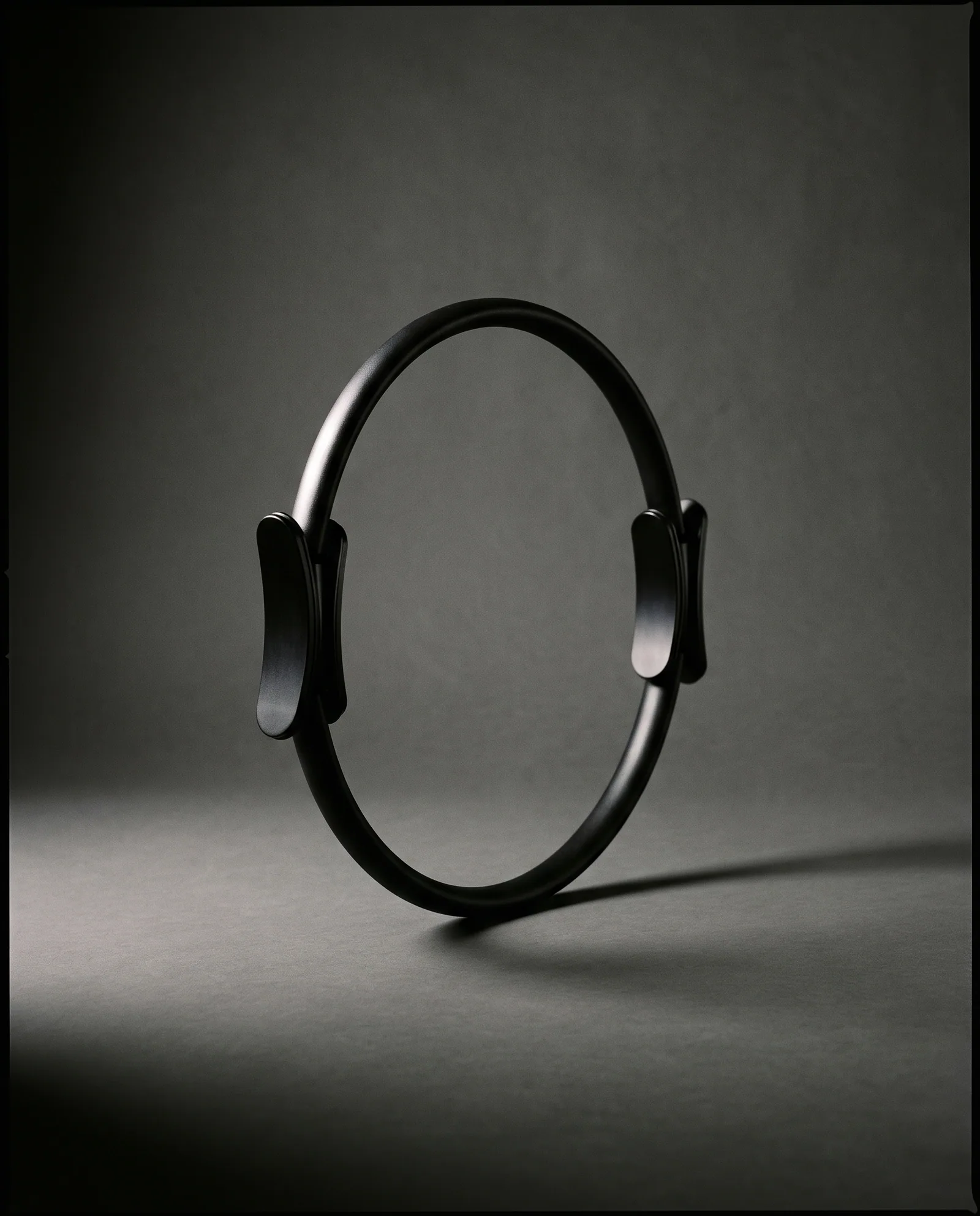 Magic Circle — Spring steel ring, machined aluminium pads.
