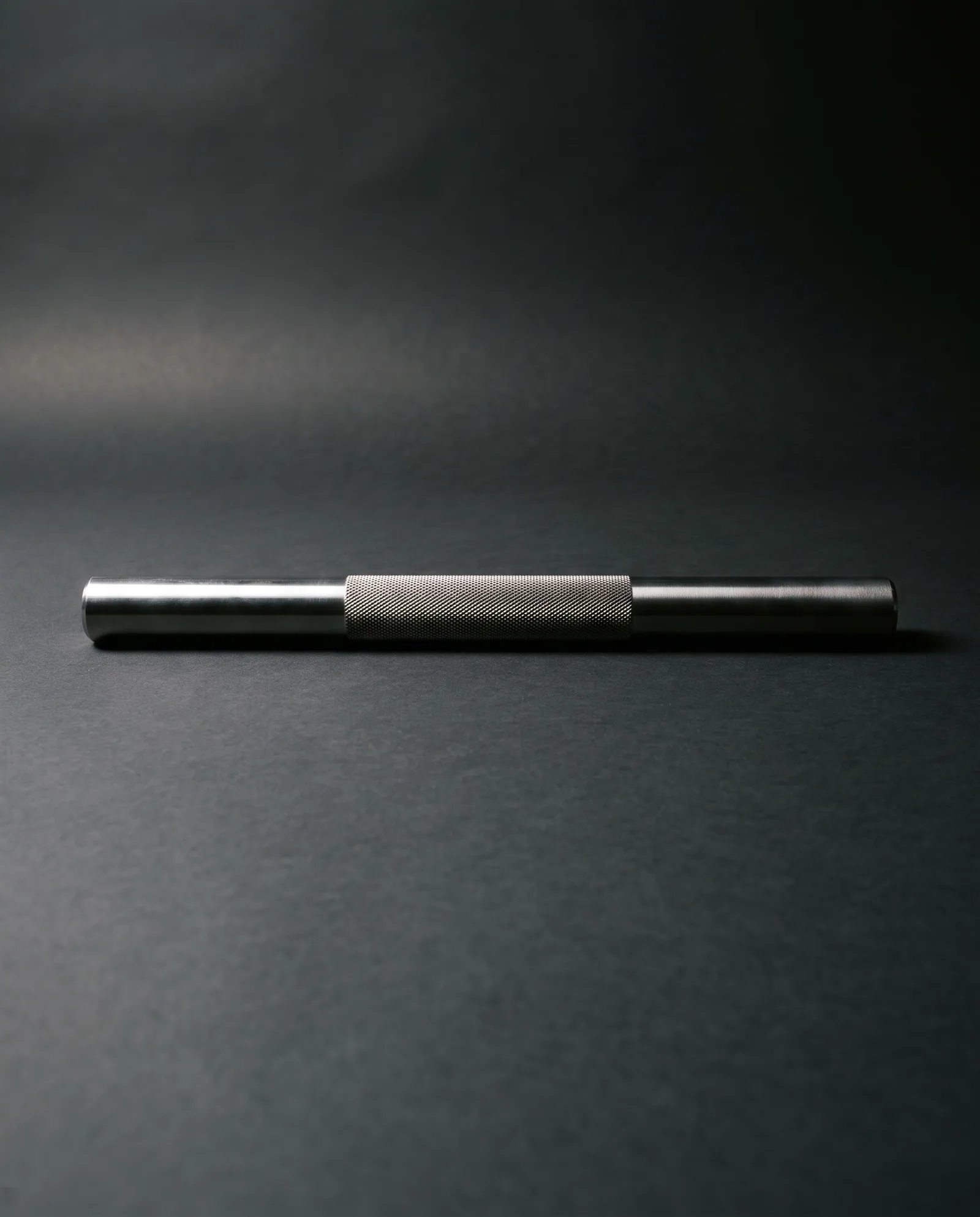 Sculpt Bar — 8 lb machined steel bar, knurled through the grip.